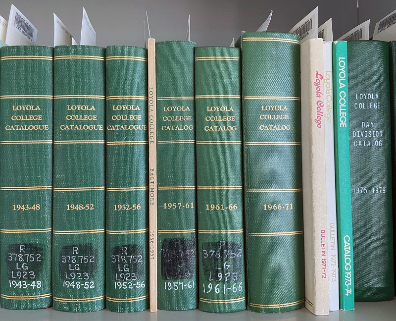 Loyola college catalogs on a shelf