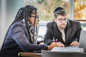 Two students working at a PC