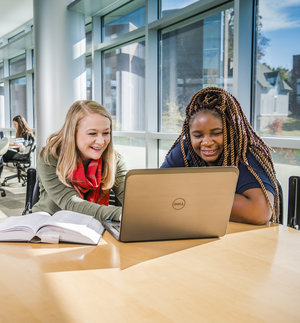 Two students working at a shared PC